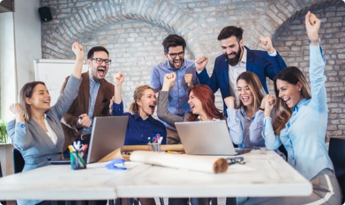 KuberAI team celebrating together in the office